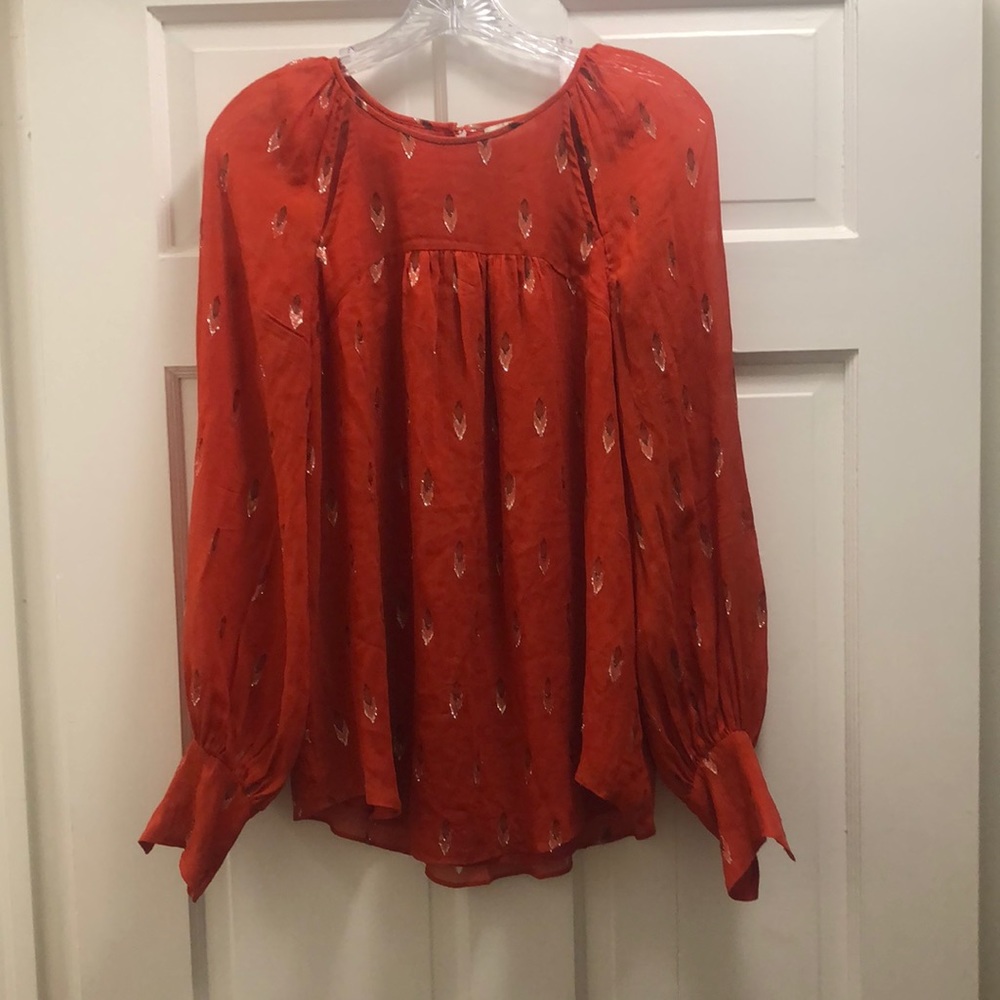 Joie. Red blouse with sparkle detail. Subtle cutouts at neckline.